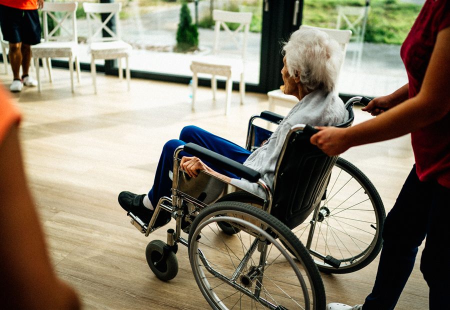 Caregiver assisting a senior resident